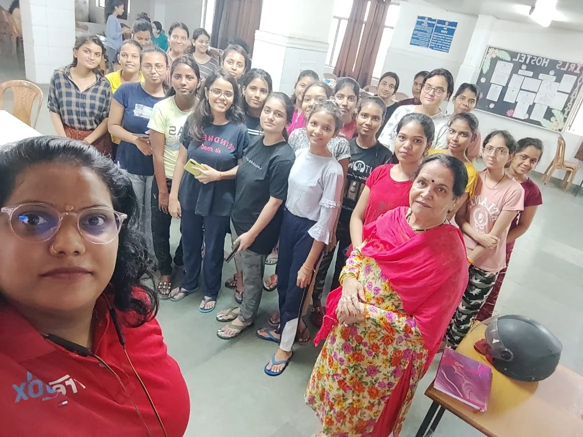 A FretBox team member meeting students and hostel staff